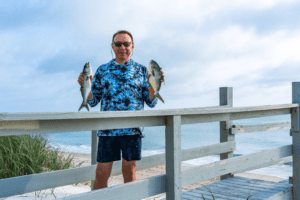 Angler practicing surf fishing technique for pompano