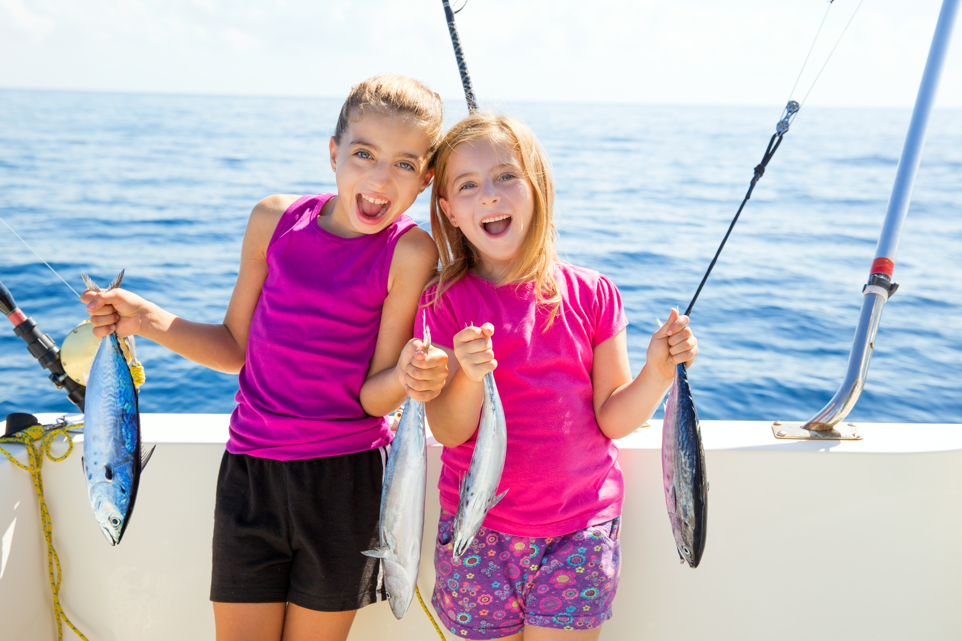 Kids having fun while fishing with a Poseidon Fishing Charter